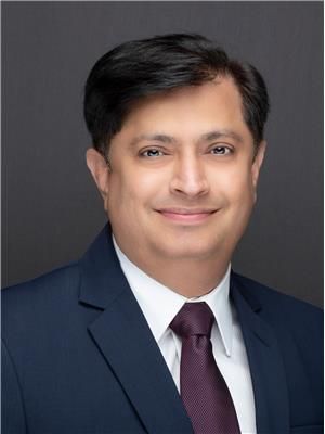 Portrait of Tushar Raval, Associate.